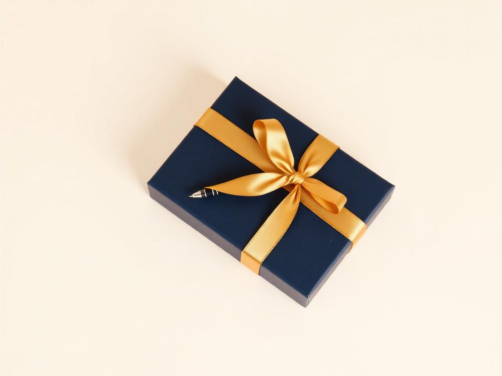Navy pen gift box finished with a gold ribbon
